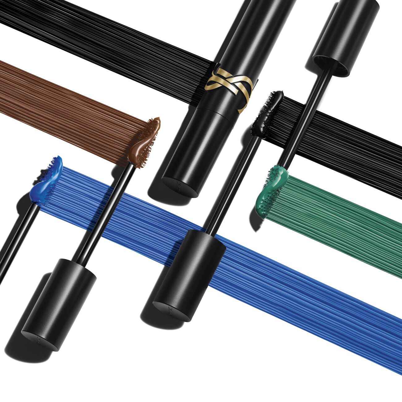 YSL Mascaras und Farbmuster in Schwarz, Braun, Blau und Grun.