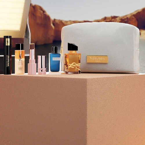 YSL Beauty-Set mit Miniprodukten und weißer Kosmetiktasche.