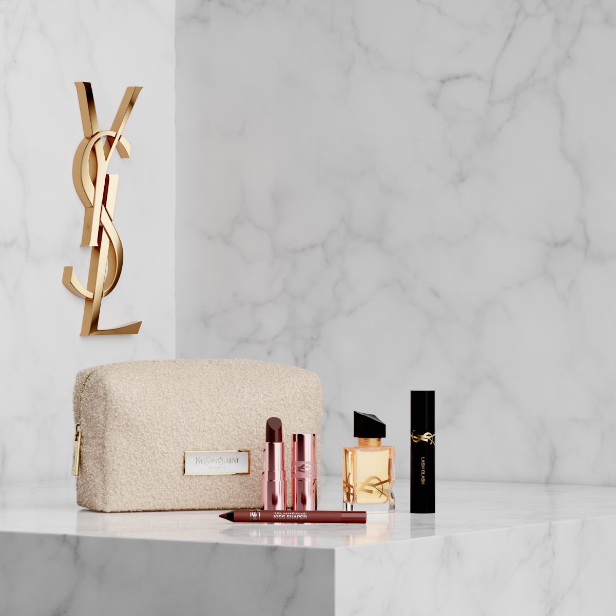 Kosmetiktasche, Libre Parfum und YSL Make-up auf weißem Marmorhintergrund.