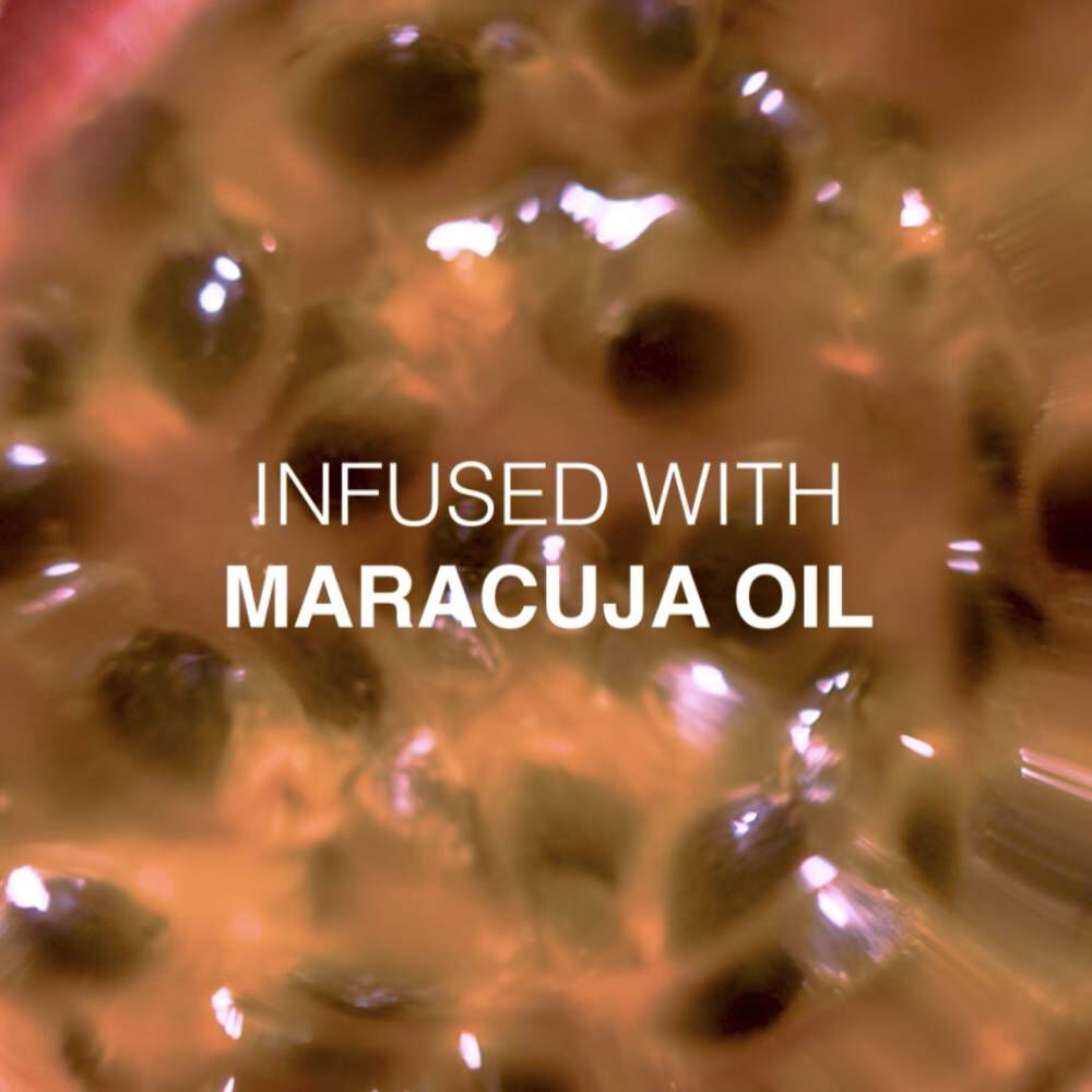 Close-up of a vibrant, abstract background with the text "Infused with Maracuja Oil" in bold white font.