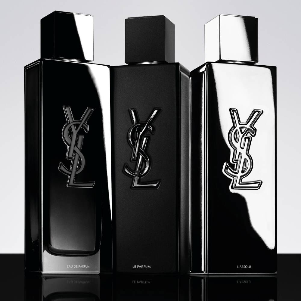 Drei schwarze YSL-Parfumflakons vor hellem Hintergrund