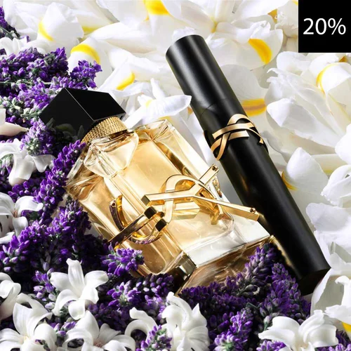Eine Nahaufnahme eines eleganten YSL Libre Parfumflakons und einer schwarzen YSL Mascara, beide mit goldenen Akzenten, eingebettet zwischen leuchtend lila Lavendel und zarten weißen und gelben Bluten. Ein schwarzes Quadrat mit weißem Text „20%“ ist in der oberen rechten Ecke sichtbar, was einen Rabatt anzeigt.