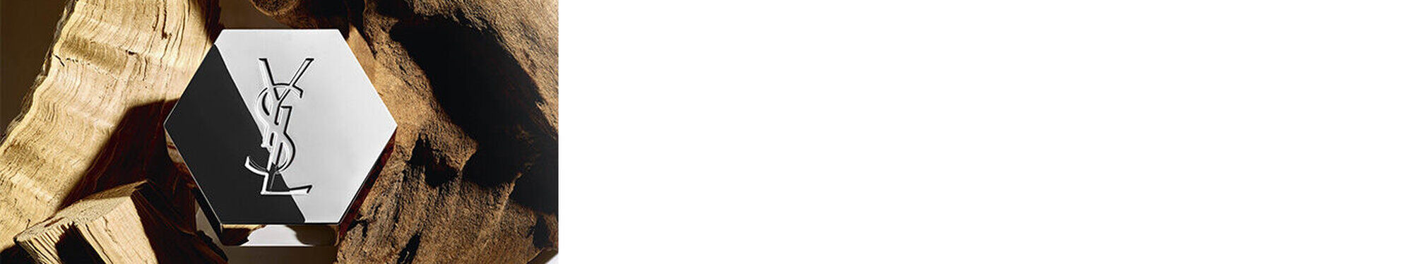 An elegant hexagonal bottle featuring a logo, placed against a background of wooden textures.