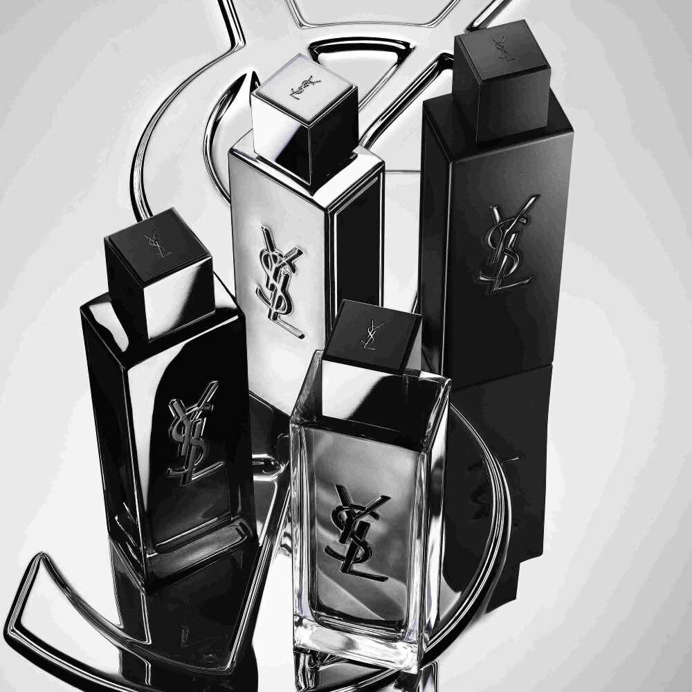 Vier YSL-Parfumflakons in Schwarz und Silber