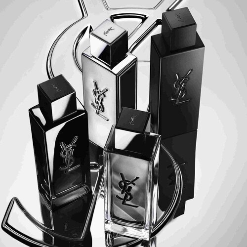 Vier YSL-Parfumflakons in Schwarz und Silber