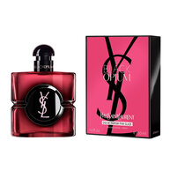 Black Opium Eau de Parfum Pink Glaze Flakon neben seiner
                        fuchsiafarbenen und schwarzen Box mit dem YSL Cassandre.
